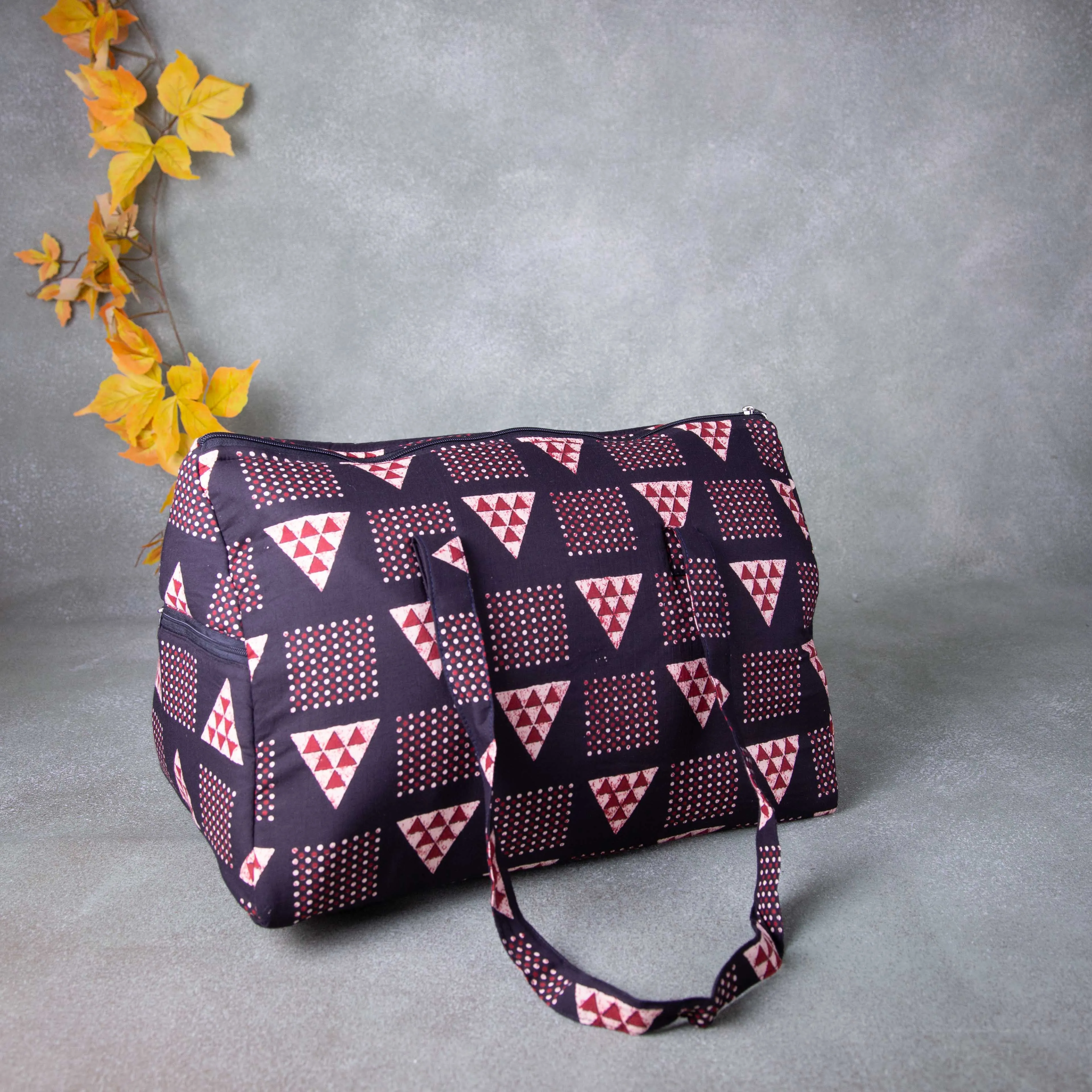 Weekender Travel Bag Black in Colour with Red Printed Design.